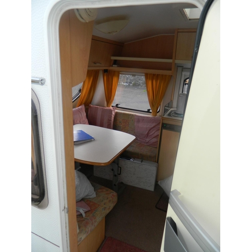 124 - Lunar 470 2003 4 berth caravan with awning, also includes inbuilt cooker, fridge, shower and toilet,... 