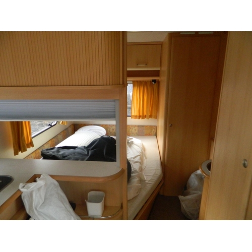 124 - Lunar 470 2003 4 berth caravan with awning, also includes inbuilt cooker, fridge, shower and toilet,... 