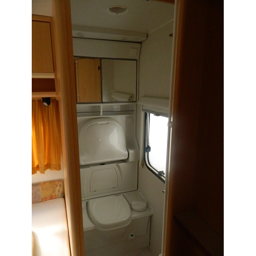 124 - Lunar 470 2003 4 berth caravan with awning, also includes inbuilt cooker, fridge, shower and toilet,... 