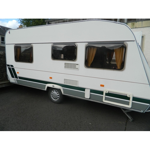 124 - Lunar 470 2003 4 berth caravan with awning, also includes inbuilt cooker, fridge, shower and toilet,... 