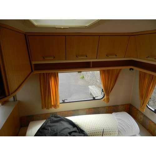 124 - Lunar 470 2003 4 berth caravan with awning, also includes inbuilt cooker, fridge, shower and toilet,... 