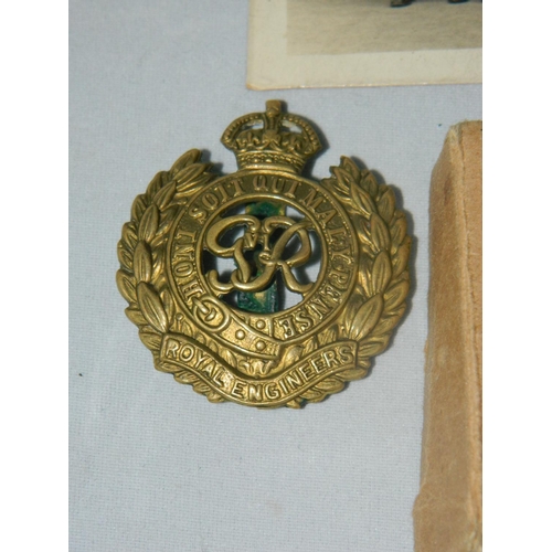 28 - WWII Royal Engineer medal in original box and other medals , also cap badge and photo