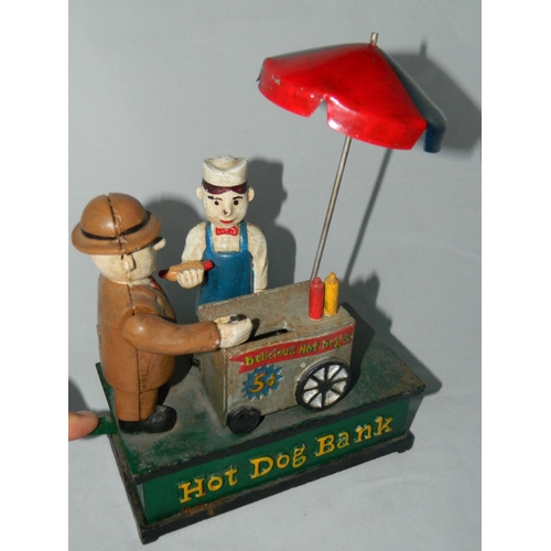 50 - Metal 'hot dog' novelty money bank with moving mechanical arm