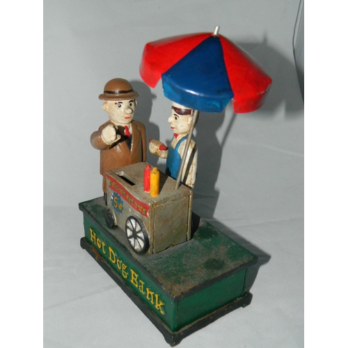 50 - Metal 'hot dog' novelty money bank with moving mechanical arm