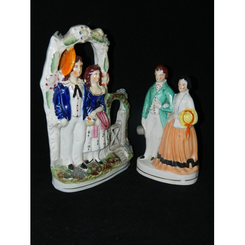 11 - Staffordshire pottery 'Courting Couple' standing in archway and Staffordshire flatback couple