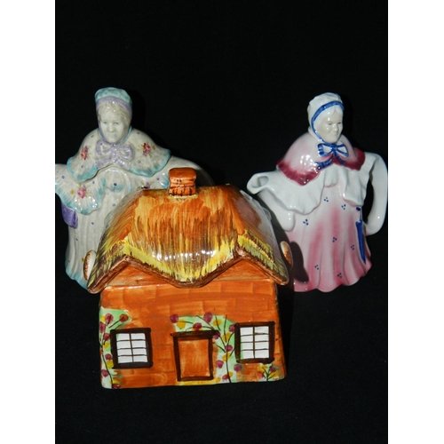 13 - 2 novelty teapots and cottage  shaped biscuit barrel