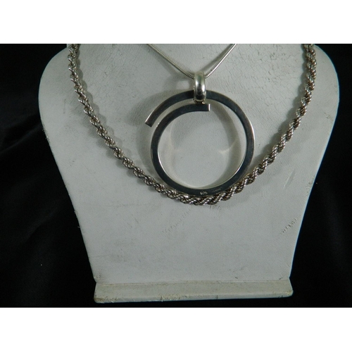 110 - Box containing silver neck chain and large circular pendant