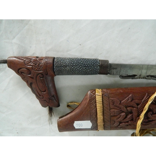 128 - Dayak mandu headhunters sword or terbang of typical form with shagreen grip and carved scabbard. Bla... 