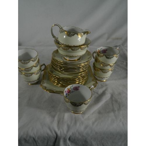 2 - 7 cup Grosvenor china tea set stamped 'B52' on base