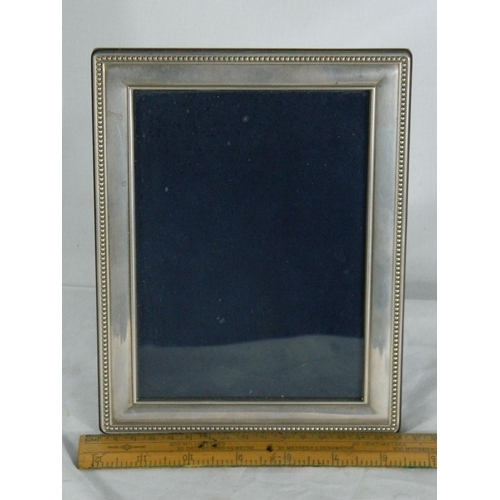 30 - Hallmarked Sheffield silver framed picture frame [16x21cm]