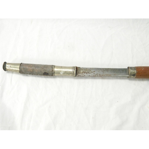 114 - Burmese Dha sword with curving T-form blade, shagreen grip and scabbard. Blade length: 59cm. Sword l... 