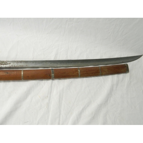 114 - Burmese Dha sword with curving T-form blade, shagreen grip and scabbard. Blade length: 59cm. Sword l... 