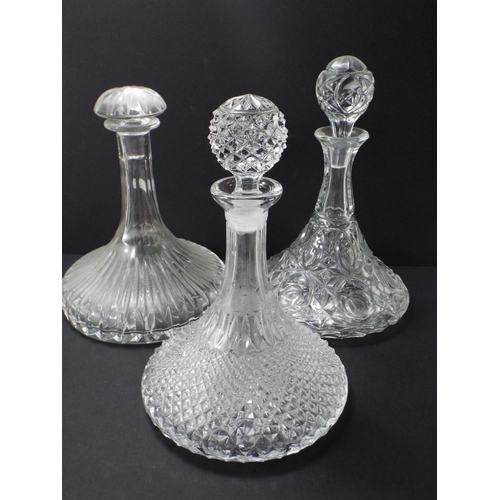 62 - 3 Cut glass ships decanters