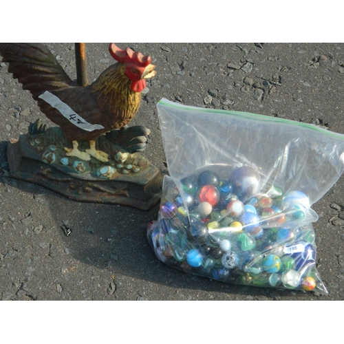 71 - Cockerel door stop and bag of marbles (some really old)