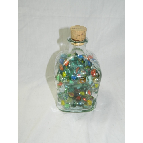 99 - Bottle containing marbles