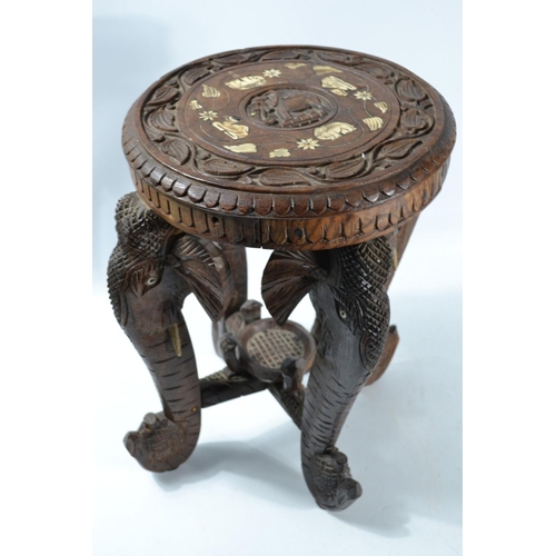 24 - Heavily carved side table with elephant design legs inlaid with bone W:40 cm approx H: 44cm approx