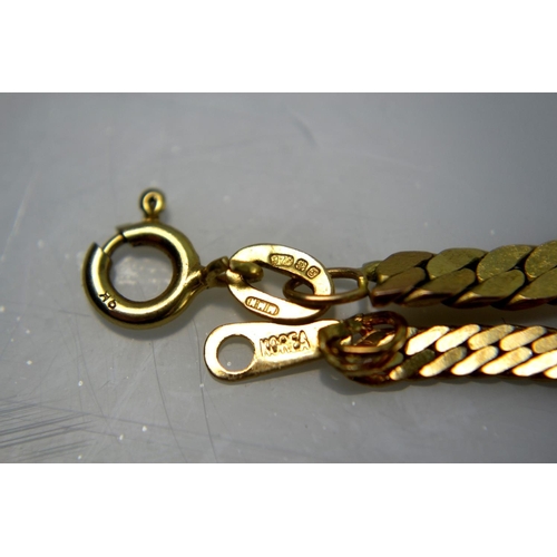 101 - 9ct Yellow gold flat link necklace, stamped 375, and a similar style bracelet stamped Korea [21 gram... 