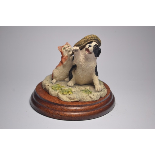 1067 - Two Anne Wall Border Fine Art puppy and kitten models on stand both Made in Scotland 'If the cap fit... 