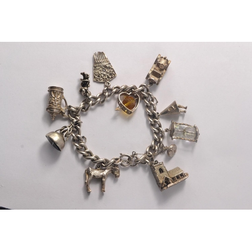 116A - Sterling silver charm bracelet with approx 11 charms. 86.16grm gross approx