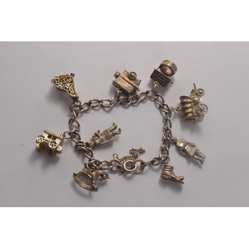 116B - Sterling silver charm bracelet with approx 9 charms 34.4grm gross approx