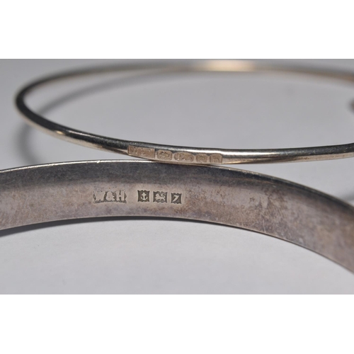 118 - Walker and Hall 1950's silver bangle and another silver hinged bangle with heart charm. Both hallmar... 