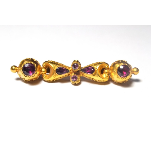 119 - Victorian gold brooch, highly decorated with wirework design, set with 6 amethysts. Unstamped but li... 