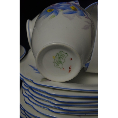 12 - Shelley china tea set, decorated with blue flower design. 12 place setting with sugar and cream and ... 