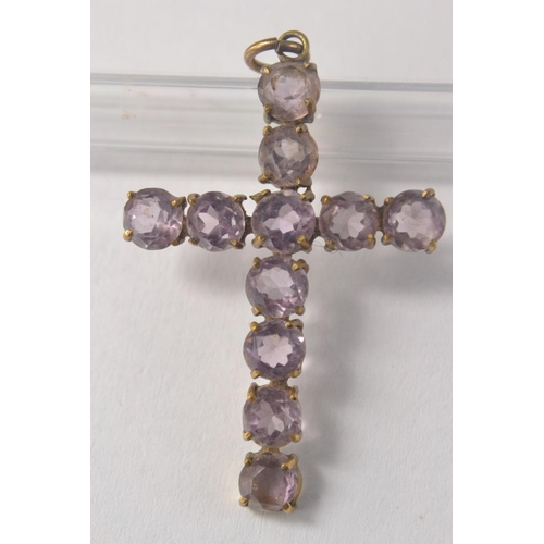 142E - Yellow metal 1 1/2 in x 1 in cross set with 11 pale pinkish stones  3.57 grm gross approx