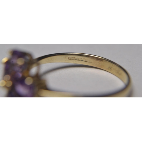 148B - 375 Stamped Tanzanite 4 heart shaped stone ring (size N)