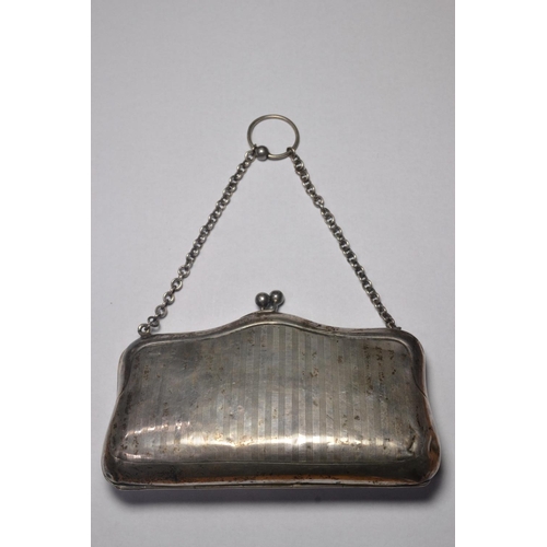 150 - Birmingham 1945 silver coin purse with engine turned design 13cm wide and weighs 120gm. Opens up to ... 