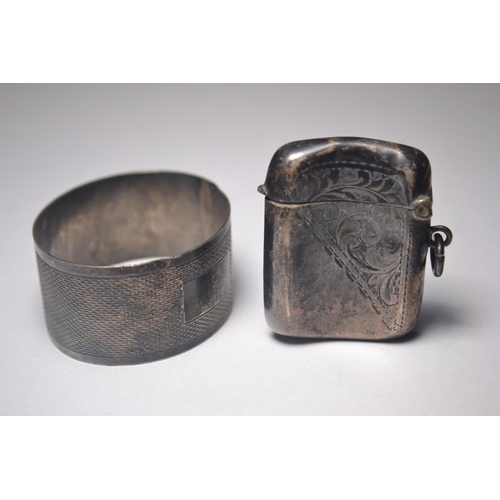 159 - Two pieces of Birmingham silver to include small vesta case complete with matches and a napkin ring