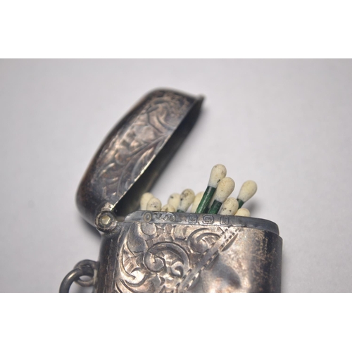 159 - Two pieces of Birmingham silver to include small vesta case complete with matches and a napkin ring