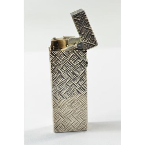 159A - White chased metal Dunhill lighter c1970's,