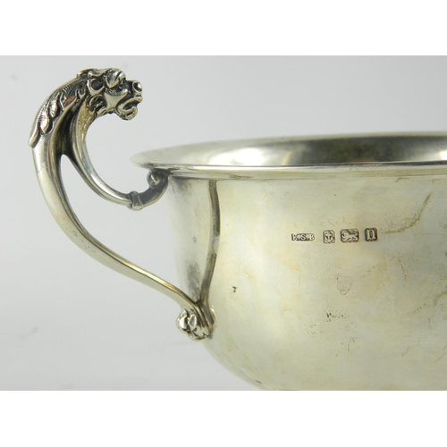 163 - George V silver presentation bowl with twin mask head handles to side, on circular footrim, with mak... 