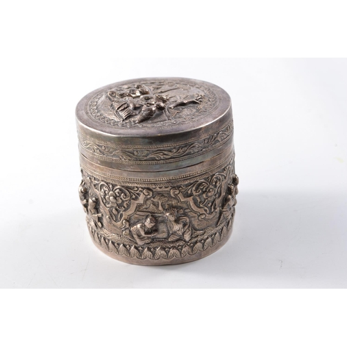 169G - Unusual Oriental silver circular lidded box with traditional intricate decoration to the base and li... 