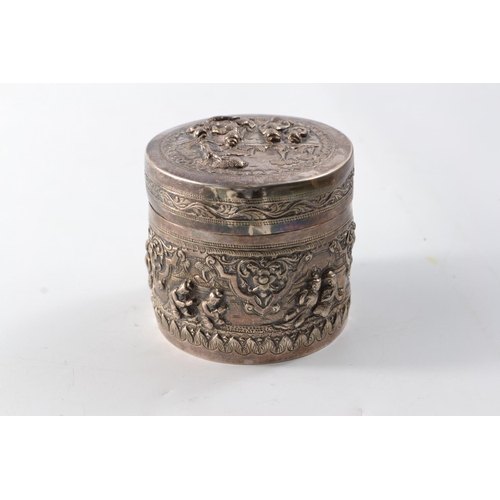 169G - Unusual Oriental silver circular lidded box with traditional intricate decoration to the base and li... 