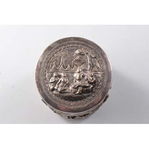 169G - Unusual Oriental silver circular lidded box with traditional intricate decoration to the base and li... 