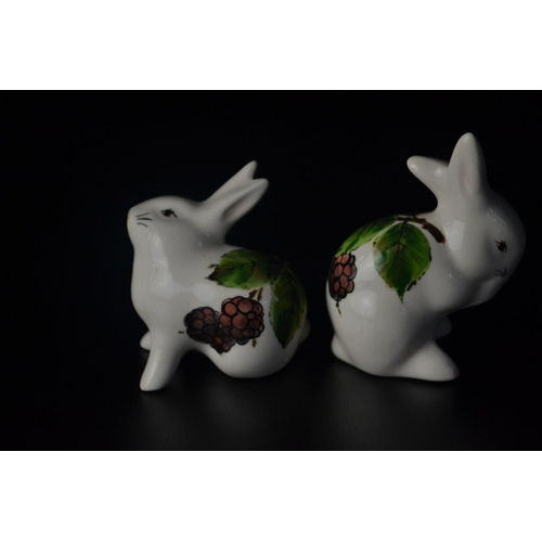 17 - Pair 'Wemyss' pottery bunnies by Griselda Hill with leaf and berry design, SB to base. [8 & 7cm high... 