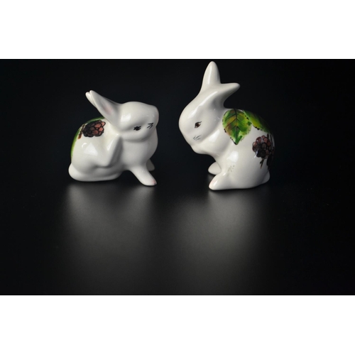 17 - Pair 'Wemyss' pottery bunnies by Griselda Hill with leaf and berry design, SB to base. [8 & 7cm high... 