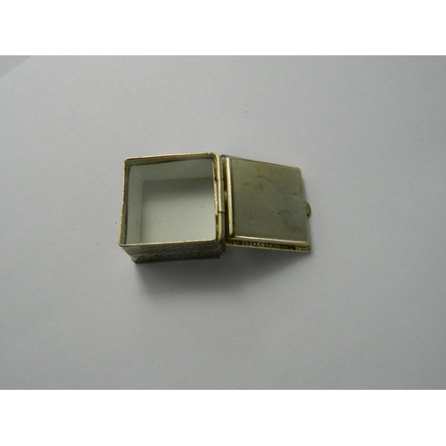 173D - Full 1913 Gold Sovereign set in a square [1 x1 inch] white metal pill box with scroll work design. a... 