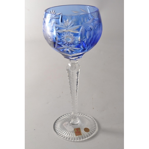 219 - Four Nachtman 24% lead crystal 'Grape' wine hock glasses in various colours to include blue, amber, ... 