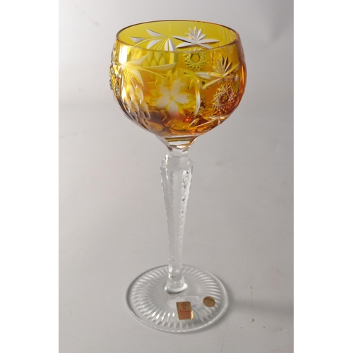 219 - Four Nachtman 24% lead crystal 'Grape' wine hock glasses in various colours to include blue, amber, ... 