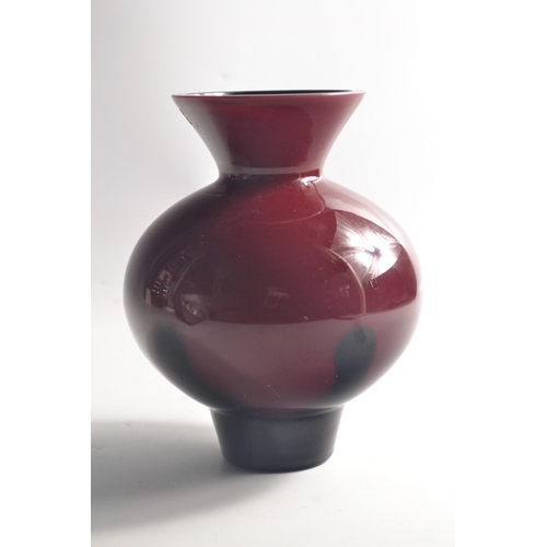 220 - CAITHNESS red ground vase with black streak pattern 18cm tall