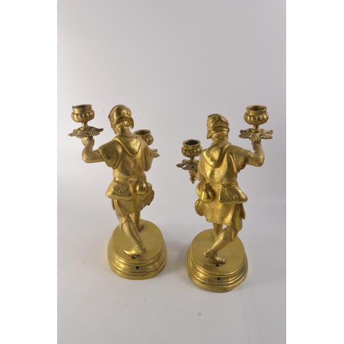 229 - Pair of brass knight figure candlestick holders