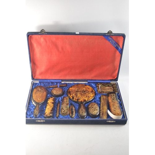 241 - Tortoise shell dressing table set in blue velvet covered hinged case