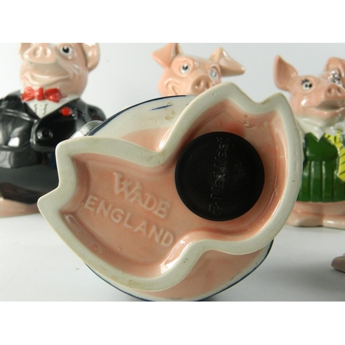 243 - Set of 5 Wade pig shaped china money banks for NatWest. Most 18cm tall