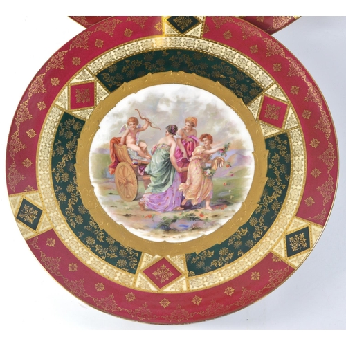 294 - Pair of Royal Vienna  scene handpainted  chargers. 32.5cm wide (crack repair on one plate)