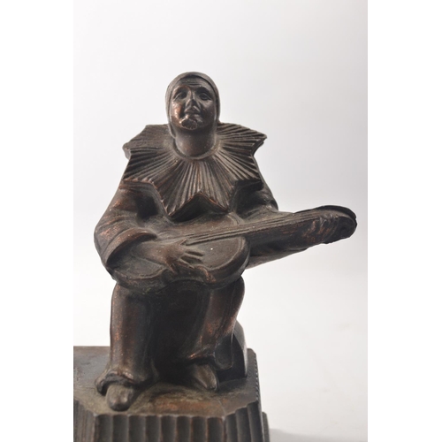 30 - 1930's Art Deco spelter lamp base in the form of a seated jester playing the guitar.