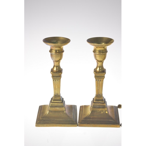 34 - Pair of Georgian square column form brass candlesticks and pair of Victorian brass candlesticks of s... 