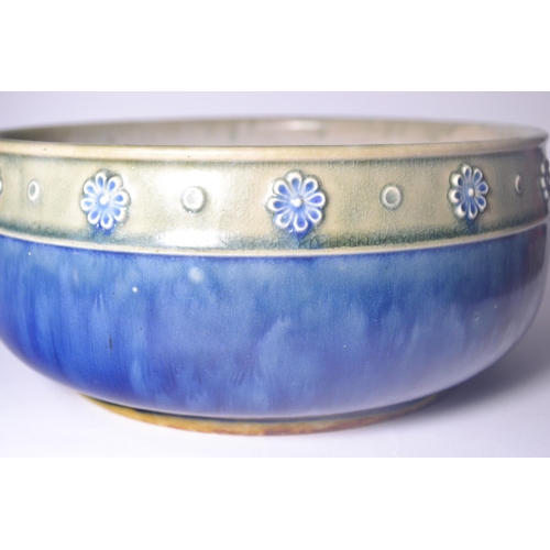 45 - Royal Doulton Pottery bowl, with greenish band decorated with blue flower heads above a blue bowl ba... 